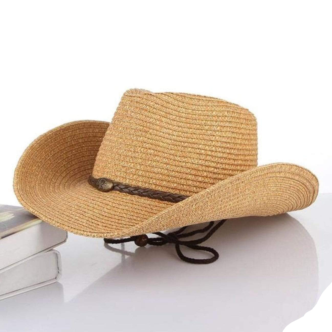 A straw cowboy hat with a brown braided band.
