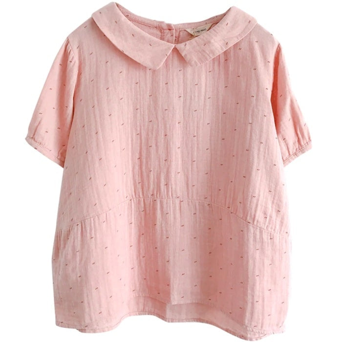 Light pink, short-sleeve blouse with a Peter Pan collar.