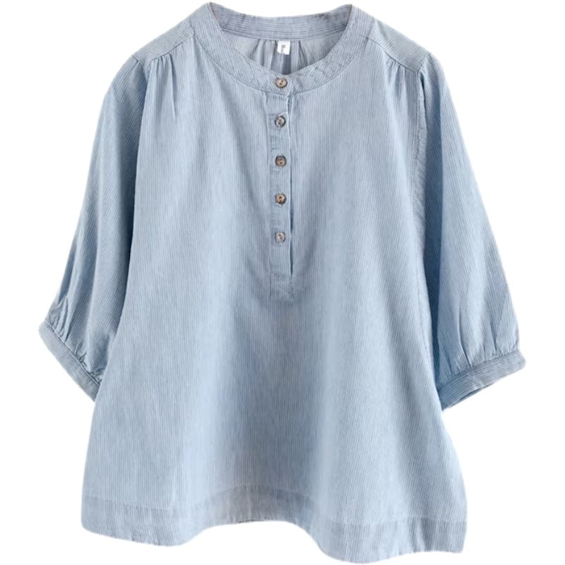 Light blue, striped tunic blouse with 3/4 sleeves and button placket.
