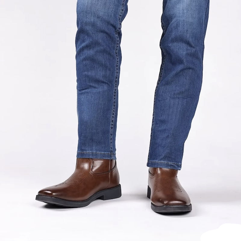 Jeans and brown leather boots.
