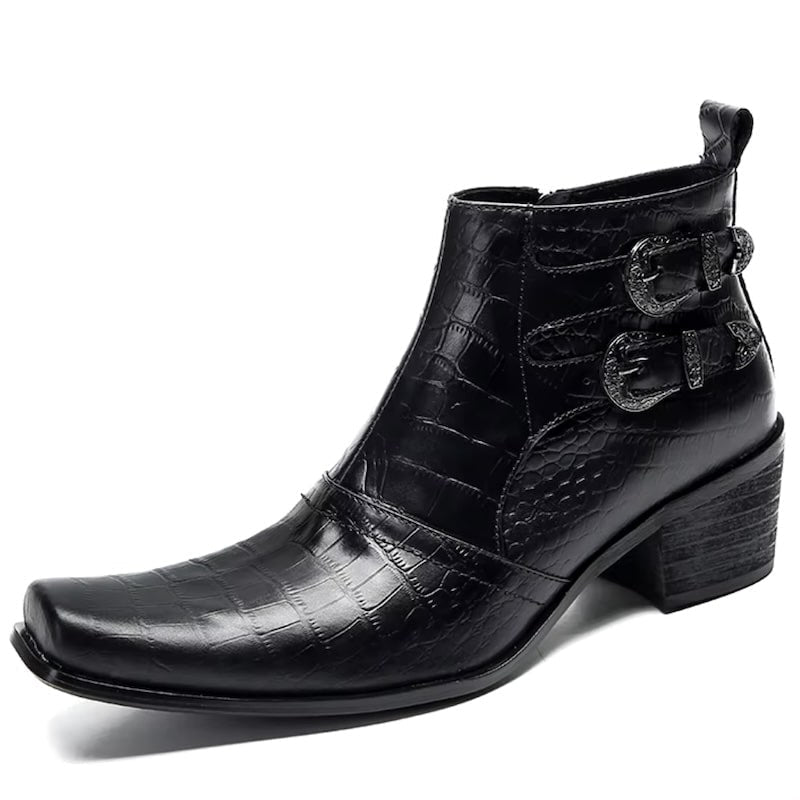 A black crocodile-patterned leather boot with two buckle closures.
