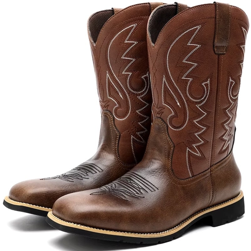 Pair of brown leather cowboy boots with white stitching.