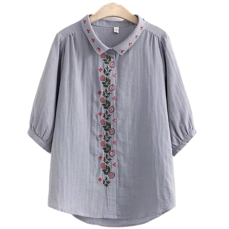 Gray linen shirt with floral embroidery.