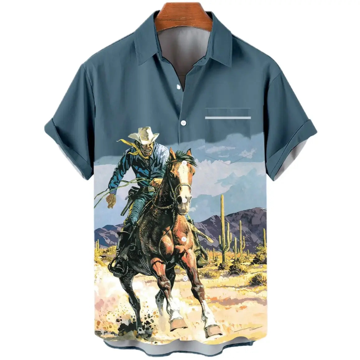 A blue short-sleeved shirt with a cowboy and horse design hanging on a wooden hanger.
