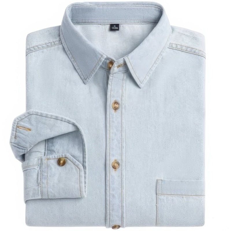 Folded, light blue denim shirt with brown buttons.