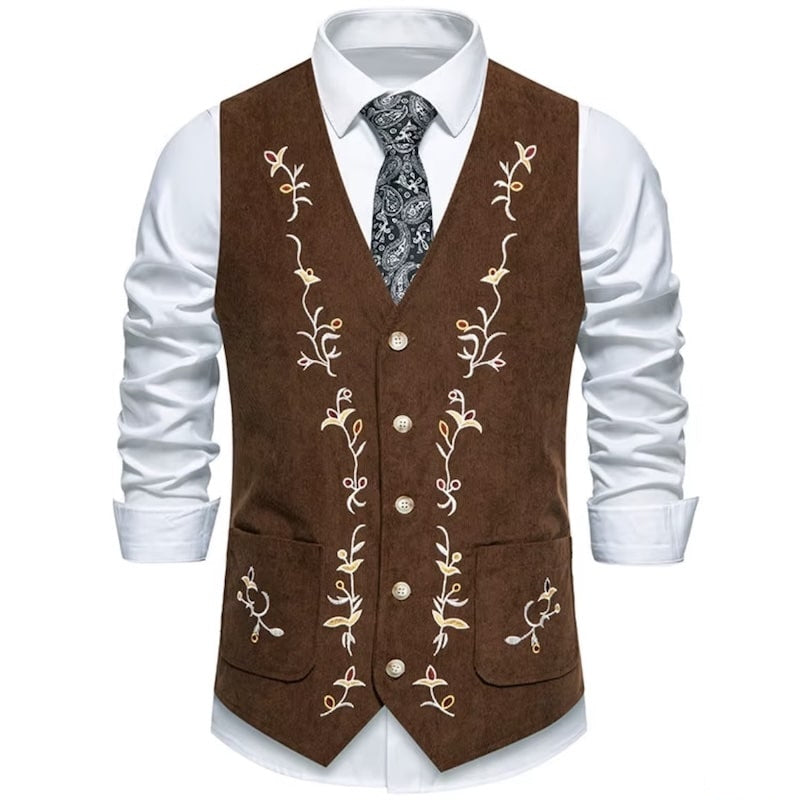 Brown embroidered vest over white shirt and paisley tie.