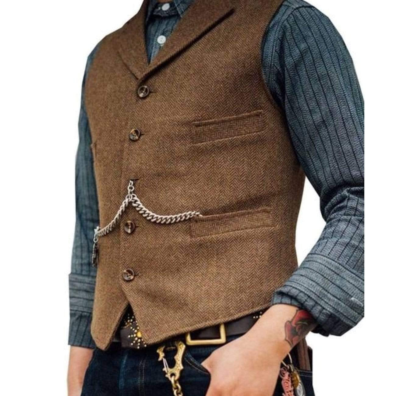 Man wearing a brown herringbone vest with a chain, under a gray striped shirt.