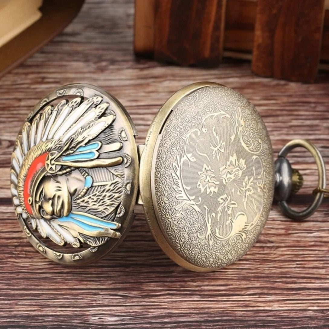 Open pocket watch with Native American headdress design.
