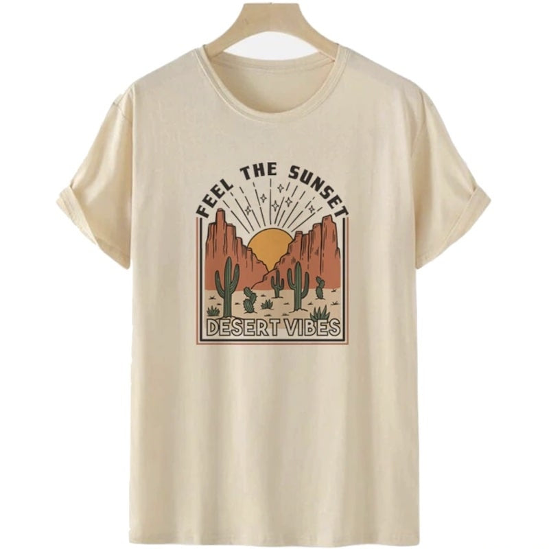 Beige t-shirt with "Feel the Sunset Desert Vibes" graphic on hanger.
