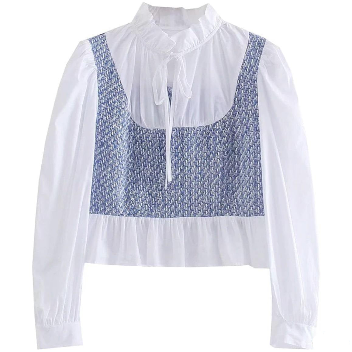 White blouse with blue textured panel.