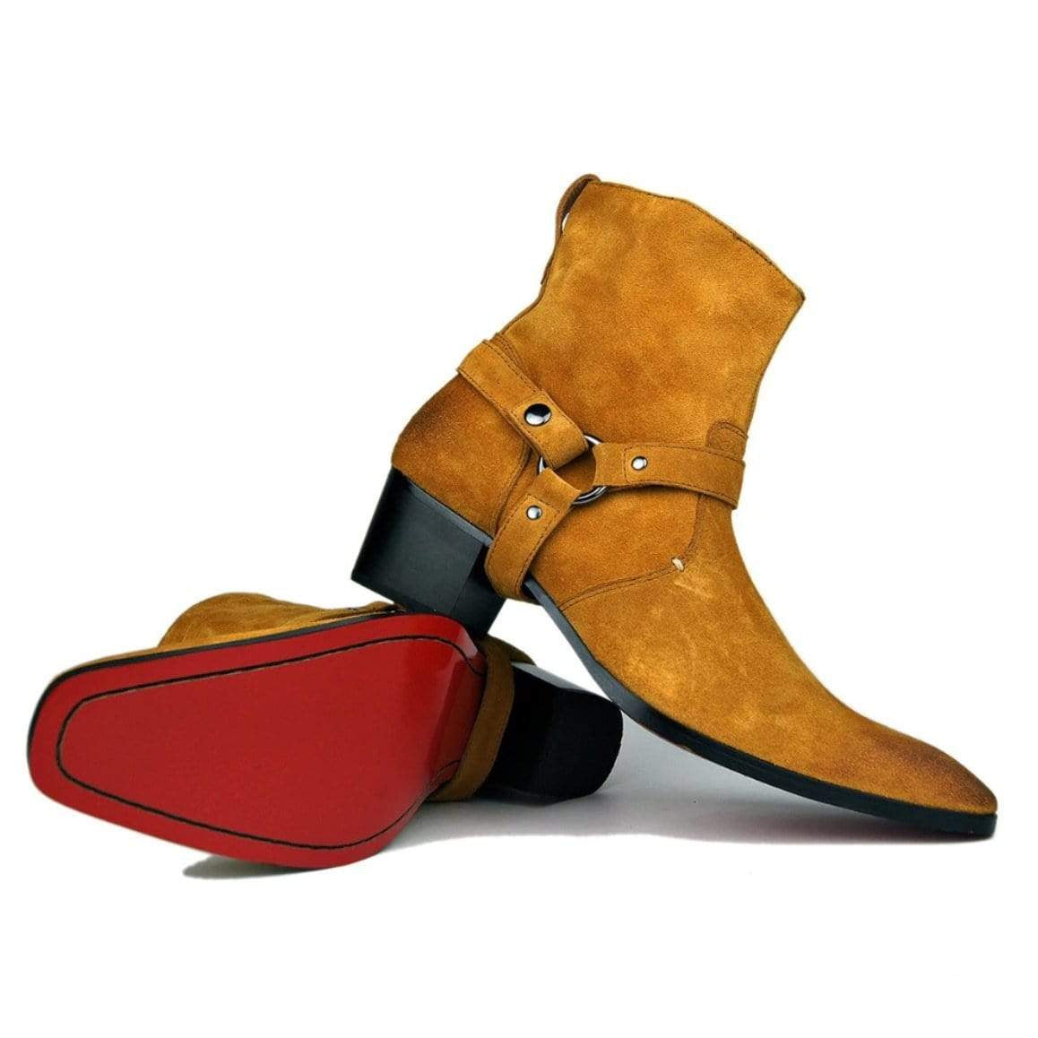 Pair of suede ankle boots, one upright and one laying with red sole visible.