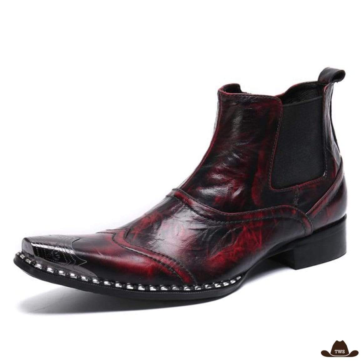 A red and black leather cowboy boot with a pointed, metal-decorated toe.
