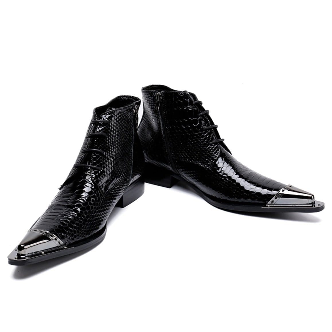 Two black, glossy, leather boots with metal toe caps.