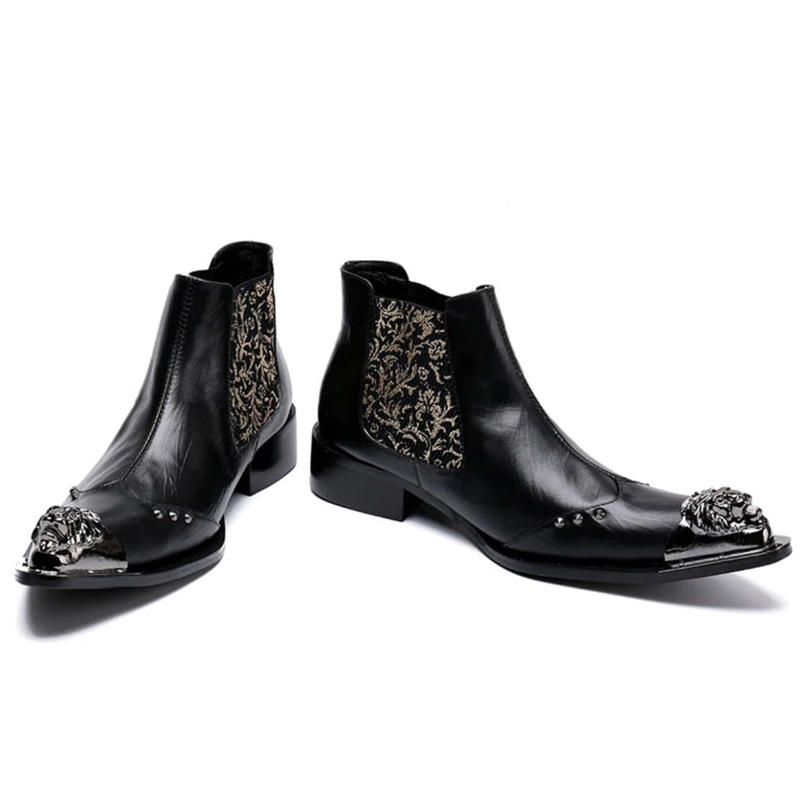 Black leather Chelsea boots with silver lion-head toe caps.