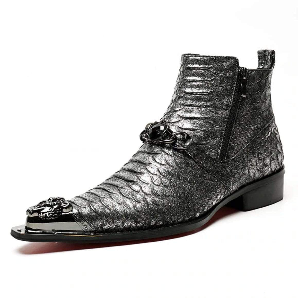 Silver snakeskin boot with decorative metal accents.
