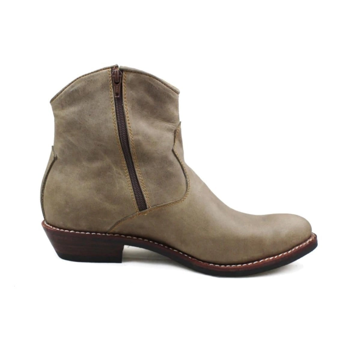 A light brown suede cowboy boot with a side zipper.
