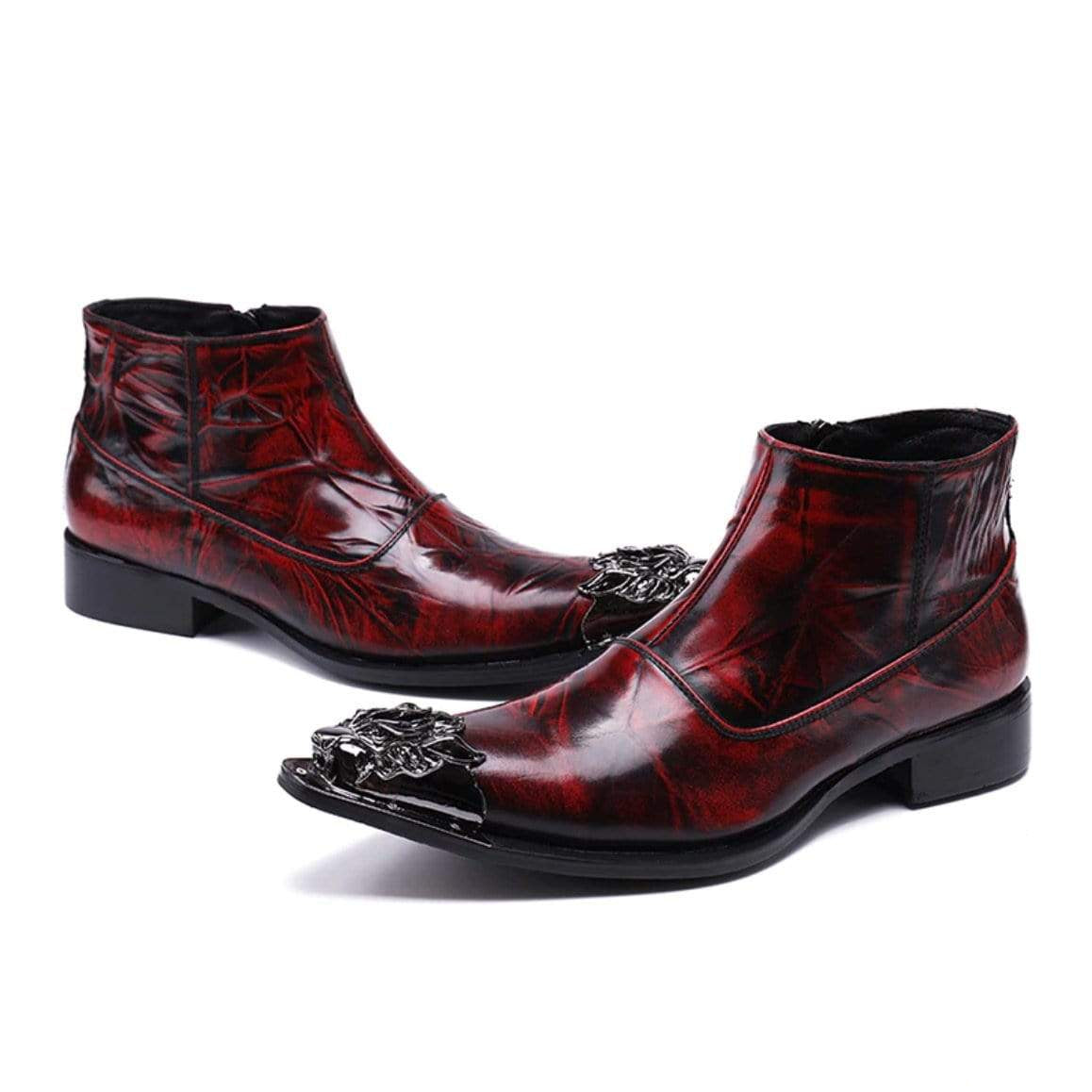 Pair of red leather ankle boots with silver toe embellishments.

