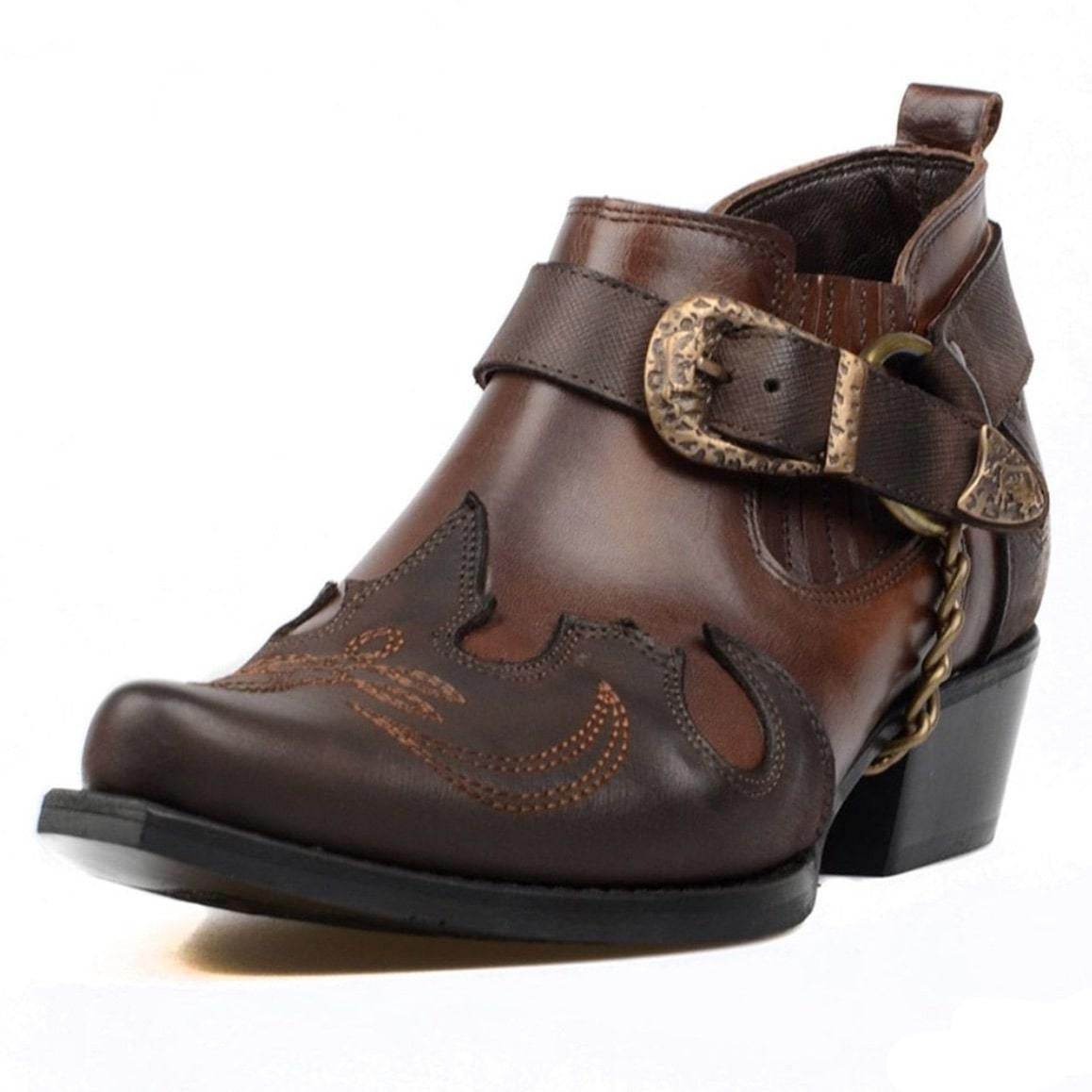 Brown leather ankle boot with decorative buckle and stitching.
