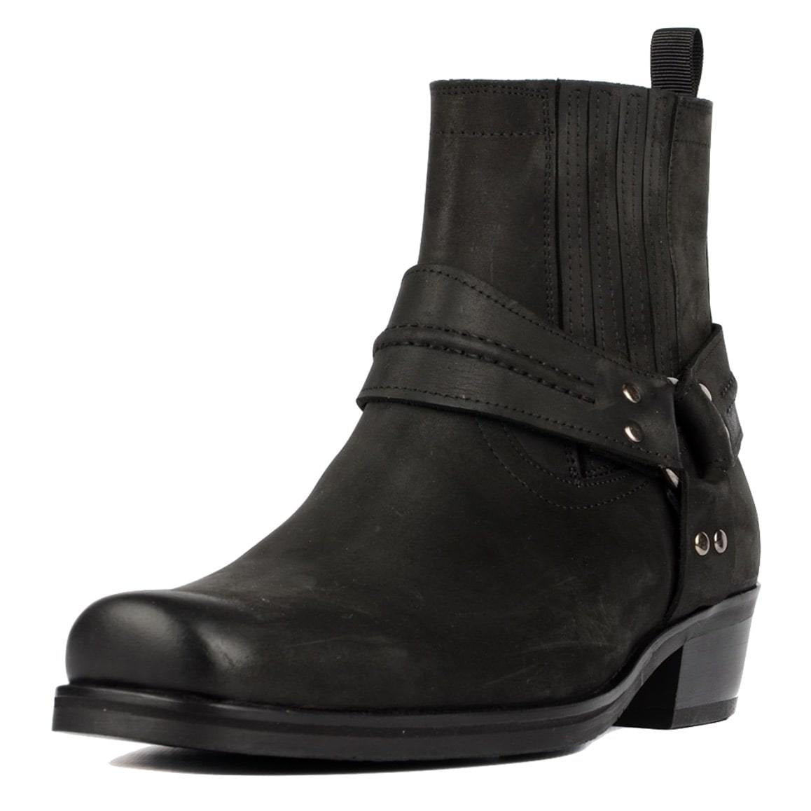 Black leather ankle boot with a buckle strap.
