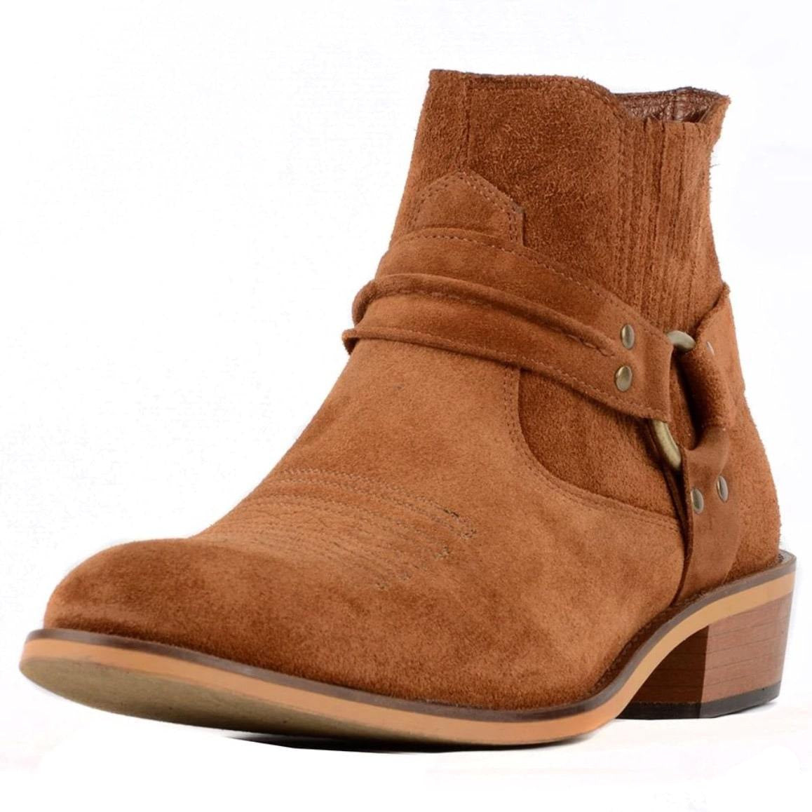 A brown suede western ankle boot with a harness.