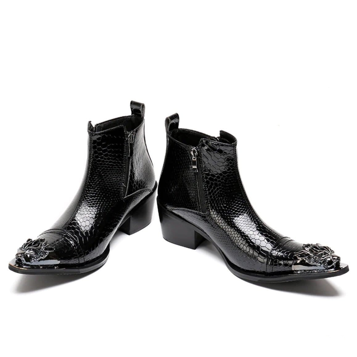 A pair of black, shiny, reptile-patterned boots.