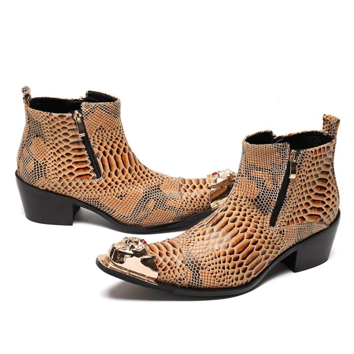 A pair of pointed-toe, snake-print leather heeled boots with gold metal toe caps.