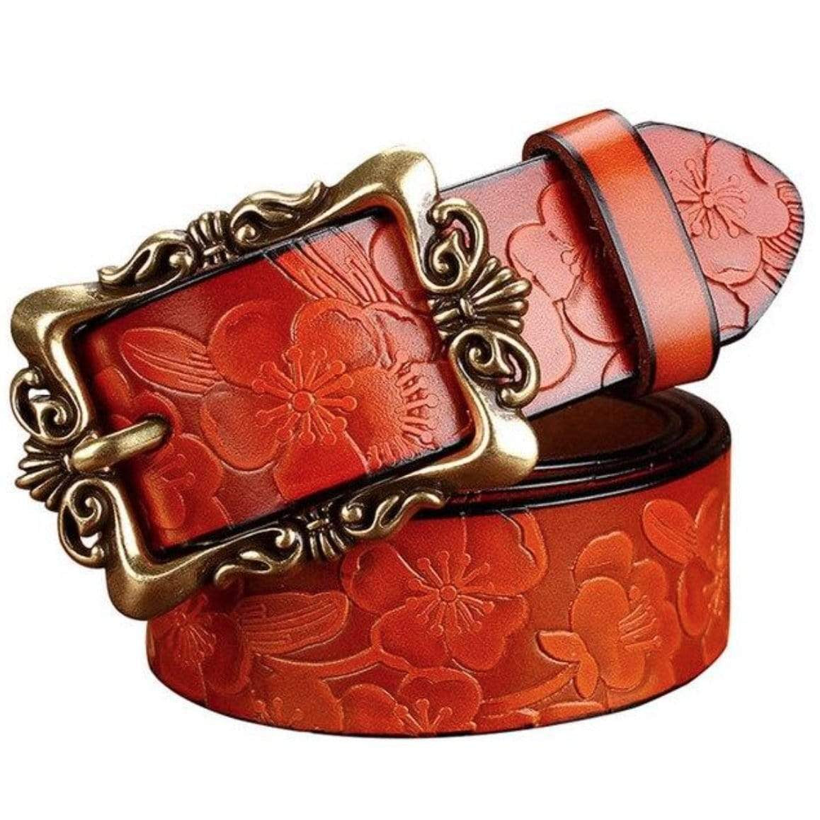 A decorative, rust-colored leather belt with a gold-toned, ornate buckle.
