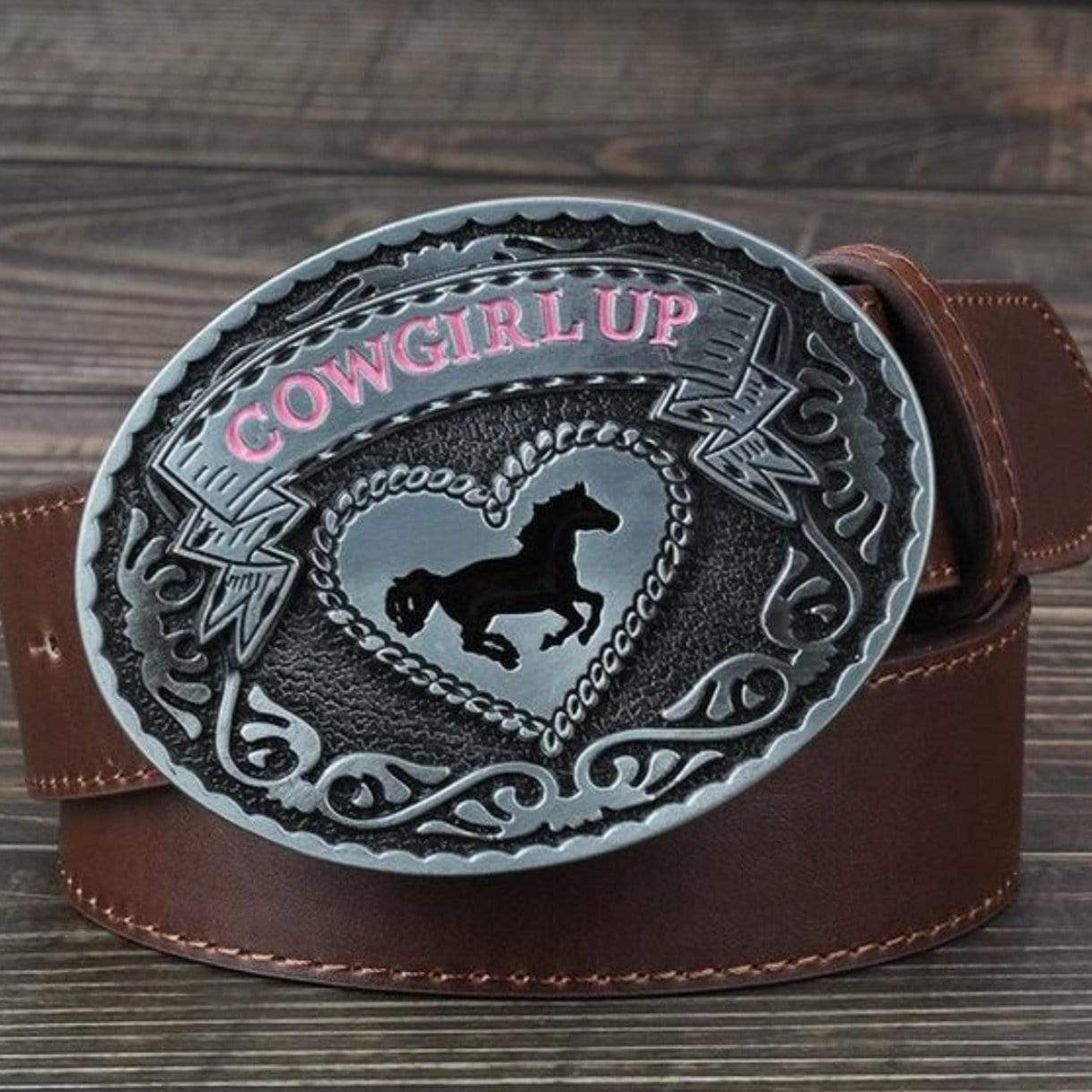 Brown leather belt with a silver cowgirl-themed buckle.