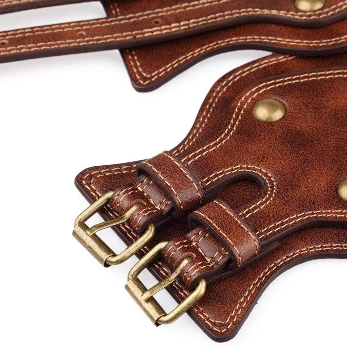 Close-up of brown leather straps with metal buckles and stitching.