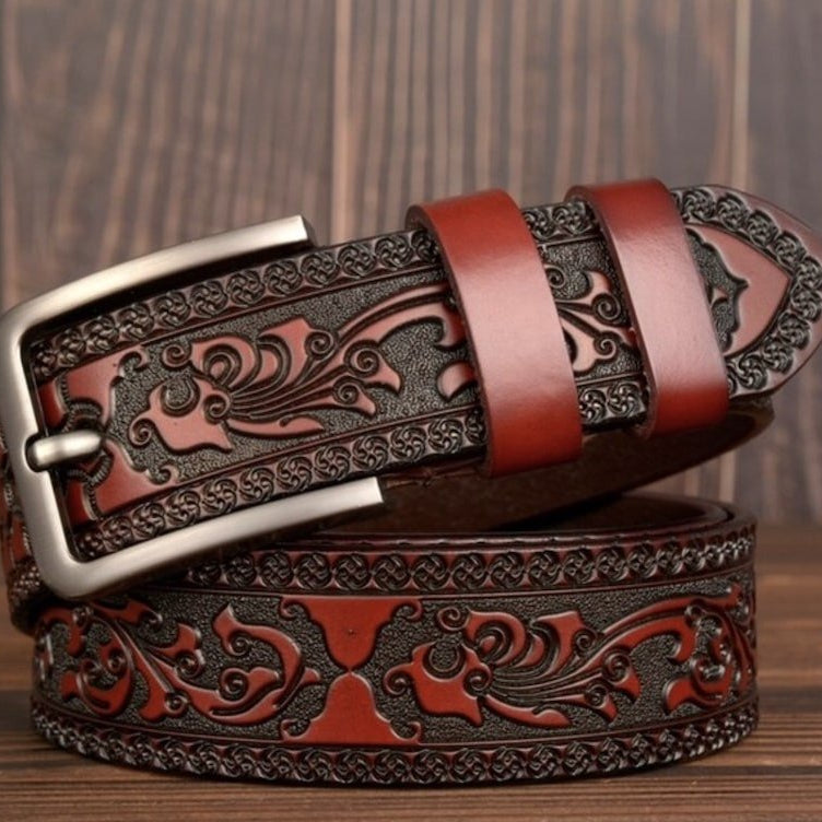 Embossed brown leather belt with silver buckle.