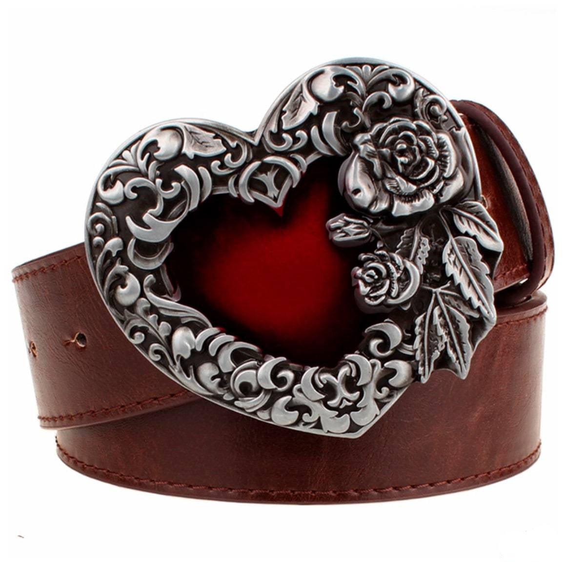 Brown leather belt with an ornate heart-shaped silver and red buckle. 
