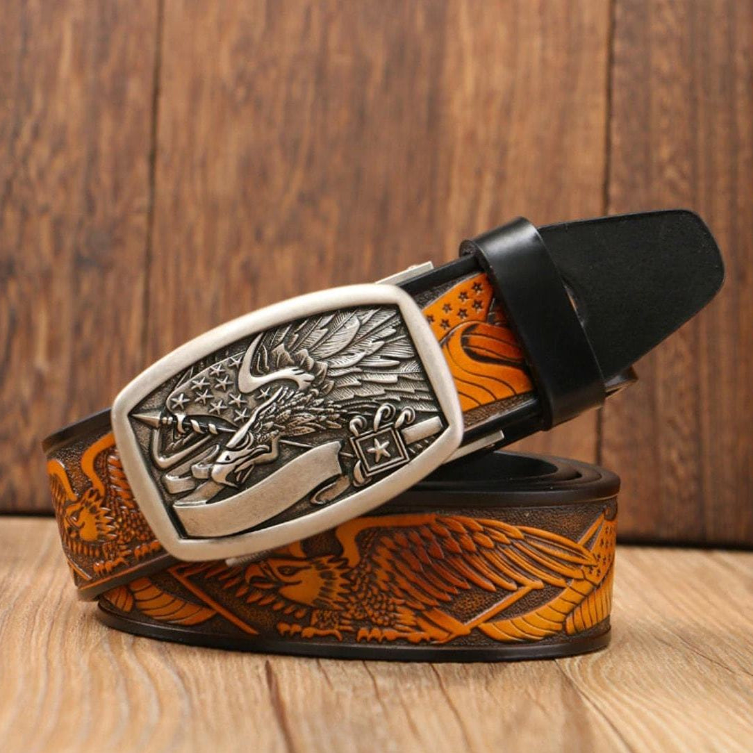 A leather belt with a silver eagle buckle.