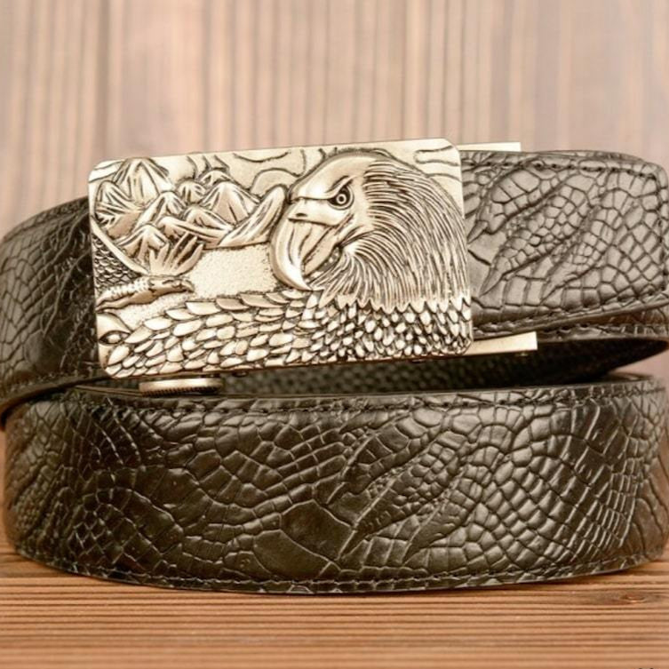 Black reptile-print leather belt with silver eagle buckle.
