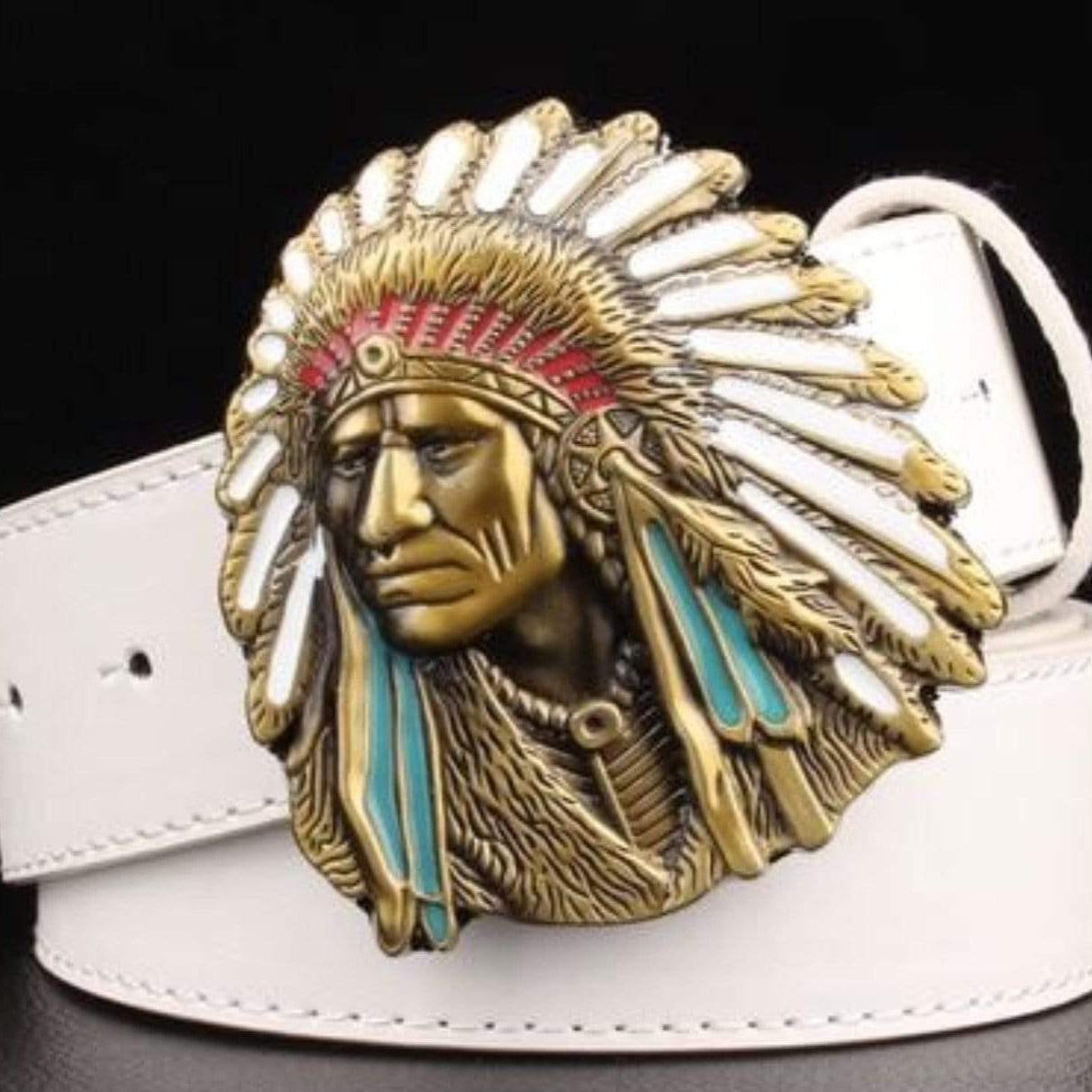 White belt with a detailed, colorful belt buckle in the shape of a Native American chief in full headdress.