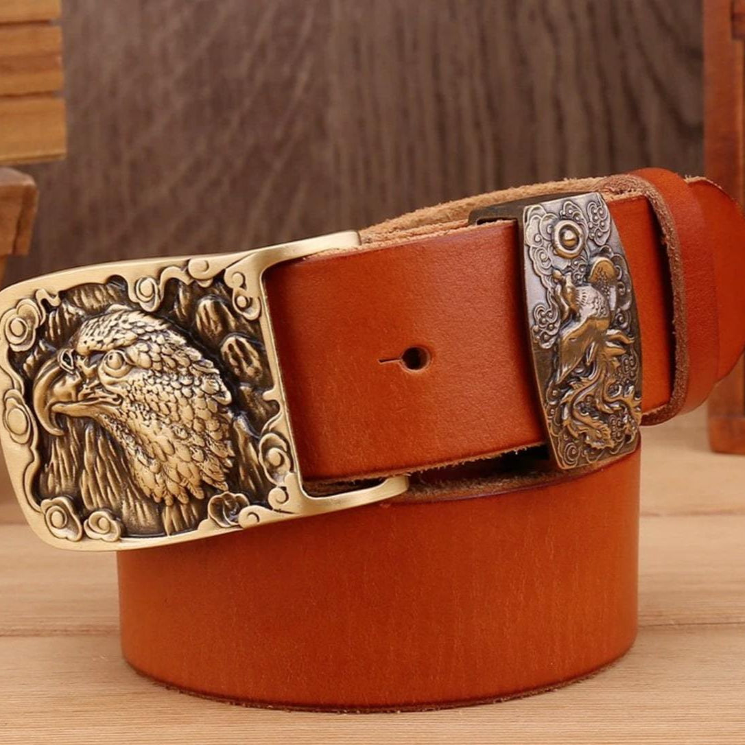 Brown leather belt with an eagle-themed buckle.
