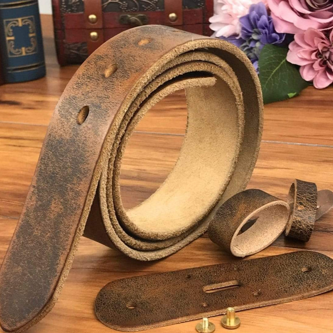 Distressed brown leather belt kit on wood table.