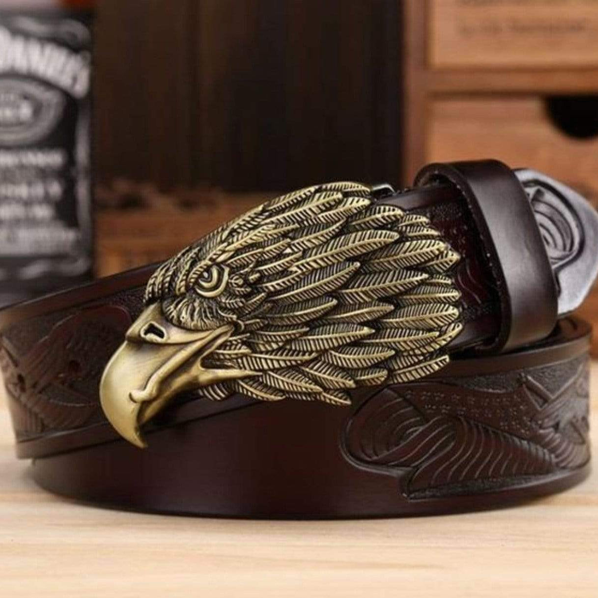 Brown leather belt with ornate gold eagle buckle.
