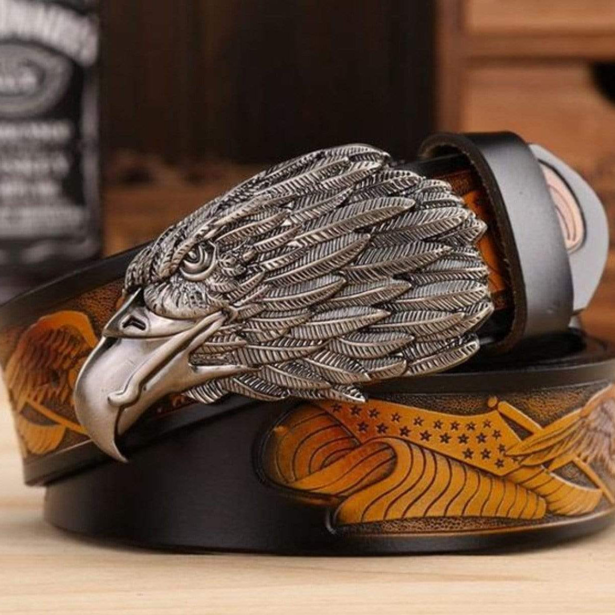 Black leather belt with a silver eagle buckle.
