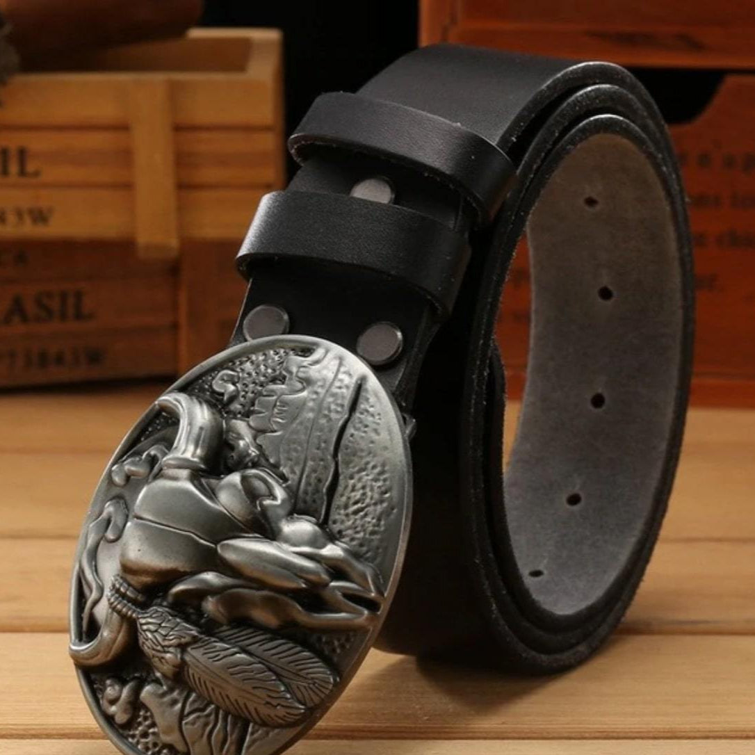 Black leather belt with silver, oval buckle featuring an Indian-themed relief.