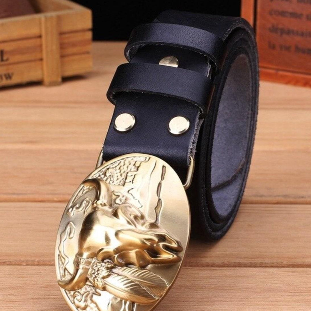 Black leather belt with gold oval buckle featuring an animal skull.