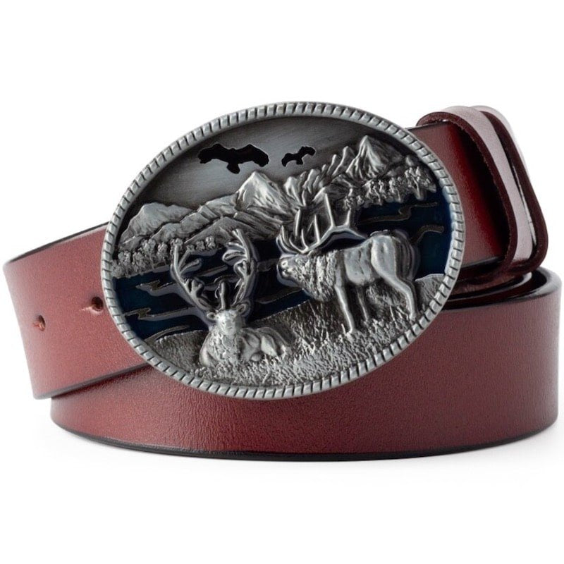 Brown leather belt with a round, silver buckle depicting two deer in a mountain scene.
