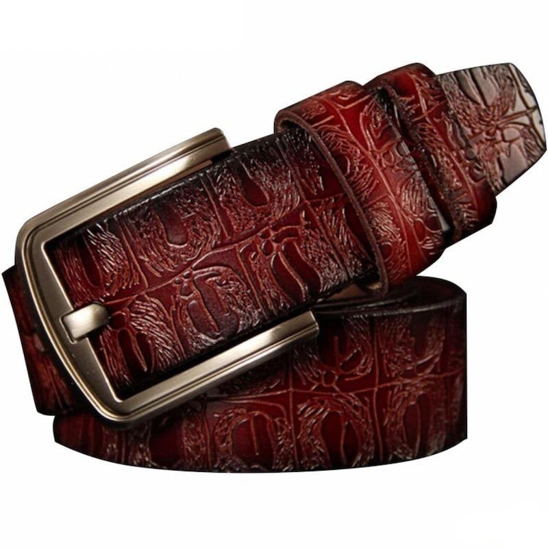 Brown crocodile leather belt with silver buckle.