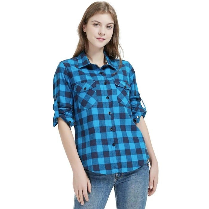 A woman wearing a blue and black checkered shirt.