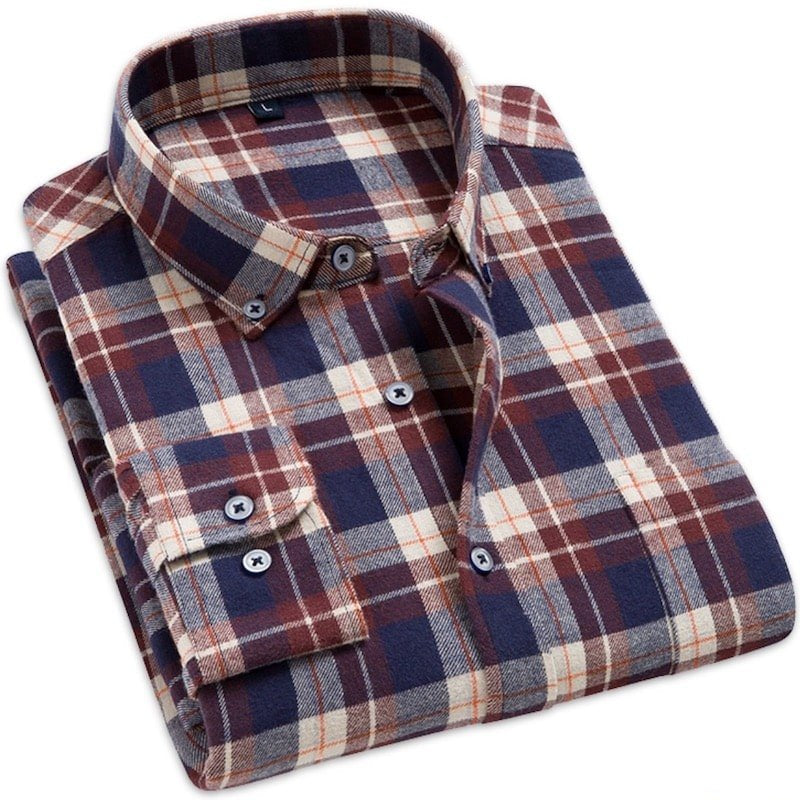 Folded, long-sleeved flannel shirt in navy, burgundy, and cream plaid.