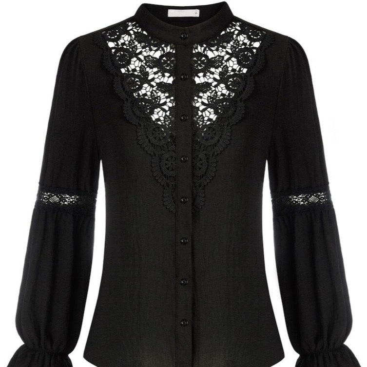 Black long-sleeved blouse with lace.