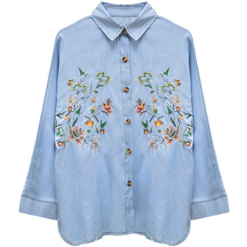 Light blue denim shirt with floral embroidery.