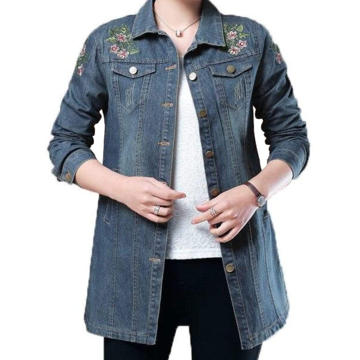 Woman in a long, embroidered denim jacket.