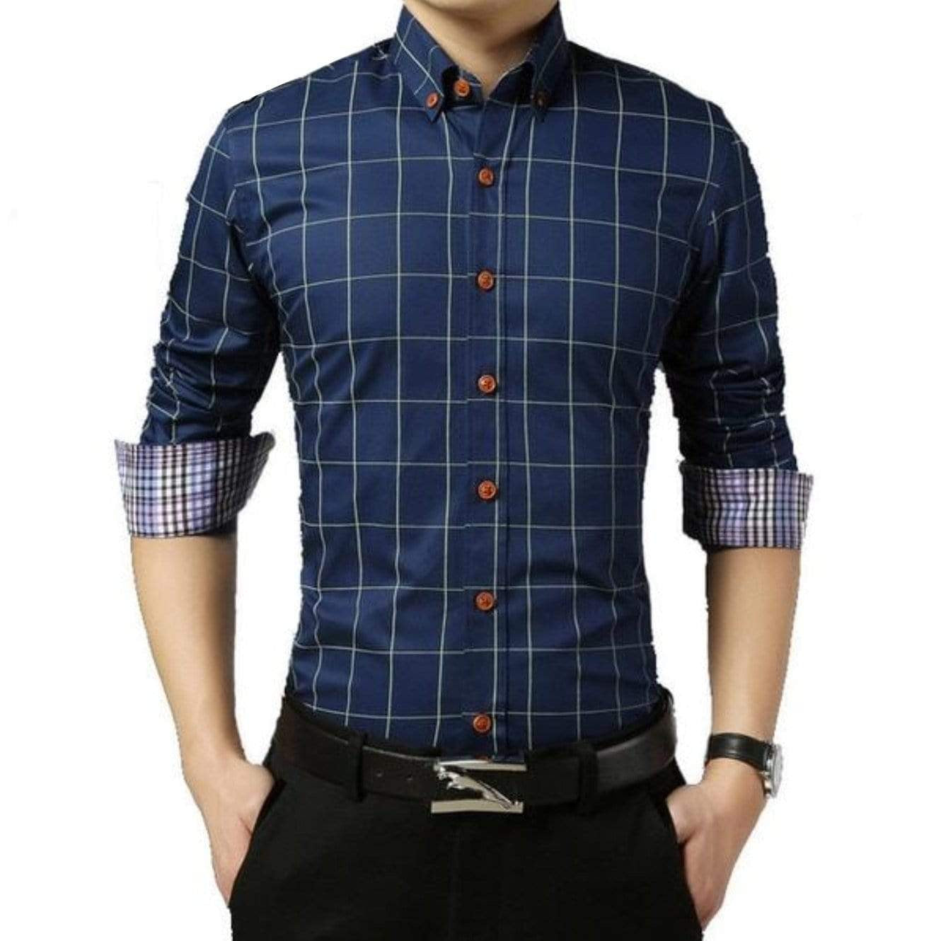 Man in blue plaid button-down shirt, black pants, and black belt.