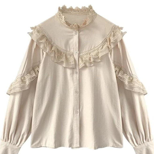 Tan blouse with lace details.
