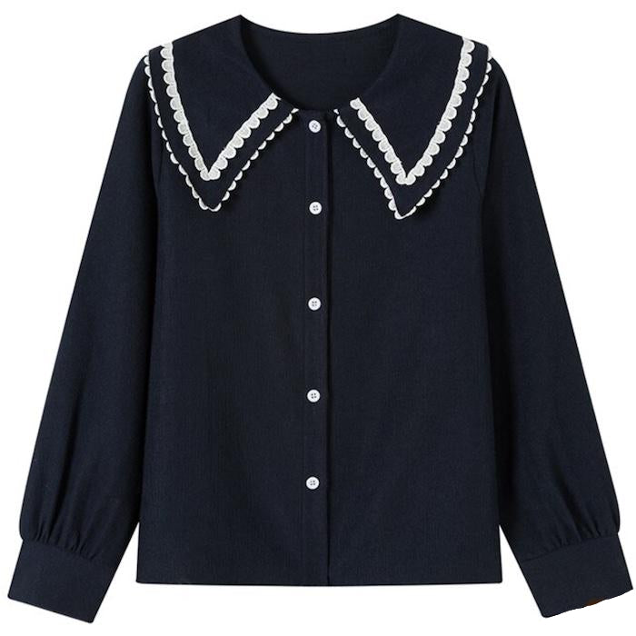 Long-sleeved navy blouse with scalloped white collar.